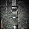 Hold Fast chrome buckles on leather bag